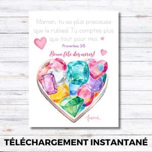 May include: A watercolour print featuring a heart-shaped box filled with colourful gemstones. The print includes text in French, with the words "Bonne fête des mères!" and "Amour" visible. The background is white.