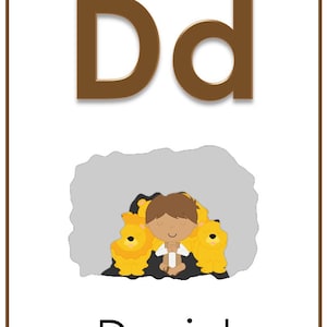 May include: A brown letter D with a lowercase d next to it. Below the letters is an illustration of a boy sitting in a den of lions. The word "Daniel" is written below the illustration.