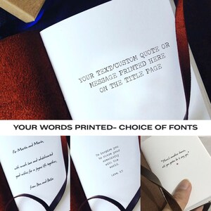 May include: A white notebook with a brown leather cover and a black ribbon bookmark. The notebook has the text "YOUR TEXT/CUSTOM QUOTE OR MESSAGE PRINTED HERE ON THE TITLE PAGE" printed on the front cover. The text "YOUR WORDS PRINTED - CHOICE OF FONTS" is printed in a banner across the top of the image. The image shows three different examples of personalised messages printed on the notebook's pages.