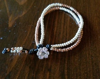 Double strand, seed bead/leather wrap bracelet.