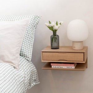 Floating oak bedside table with drawer and shelf