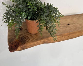 Eco-Friendly Sustainable Live Edge Shelves with two Sleek Iron Brackets.