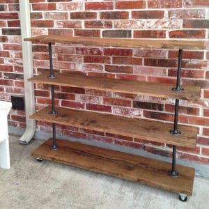 Rolling shelving cart with various heights. Bar Cart, Industrial farmhouse clothes storage, Retail display fixture, shoe and towel rack.