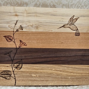 handmade wood cutting board with humming bird