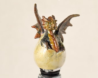 Mythical dragon hatchling bottle stopper.