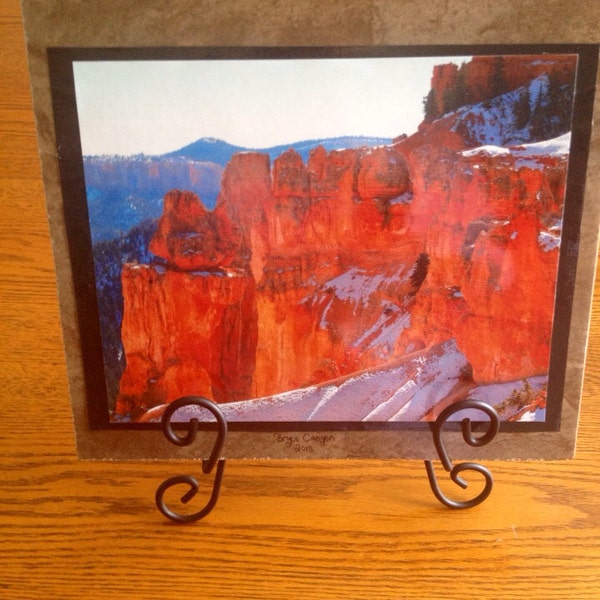 Photo mounted on a tile including stand