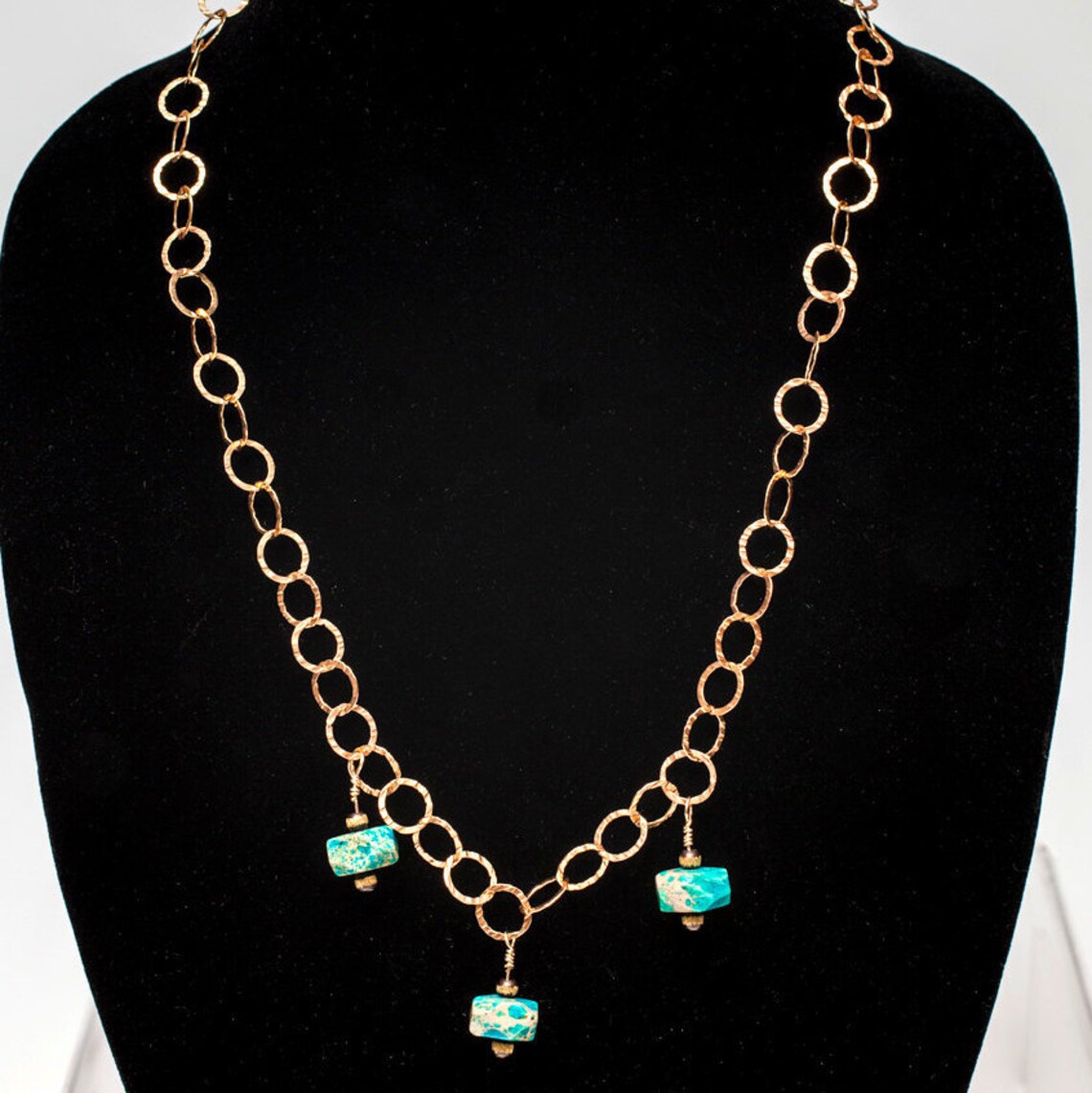 gold chain with turquoise pendant