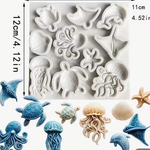 May include: A collection of sea creature molds and figurines. The molds are white and include a turtle, starfish, octopus, and jellyfish. The figurines are blue, tan, and white, and include a dolphin, stingray, and seashell. The image is 4.12 inches wide and 4.52 inches tall.