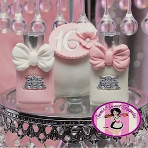 May include: Pink and white decorative cake pops shaped like perfume bottles and a cake with a number 16 on top. The cake pops have bow accents and silver embellishments. The cake pops are on a silver tiered stand.