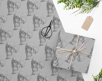 May include: Gray wrapping paper with a repeating pattern of black and white anatomical skull illustrations.