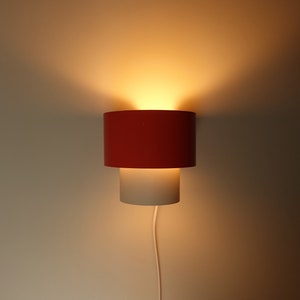 Graphic Philips NWS 32 32 orange and white metal round wall lamp sconce symmetrical Dutch design light 1970s mid century modern