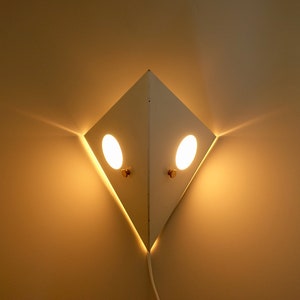 Raak Amsterdam night owl white metal wall light lamp bedside plexiglas acrylic Dutch design creative fixture mid century modern Holland 1960