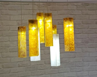 Fused glass pendant lights in amber and white colors. Chandelier Lighting, pendant lighting