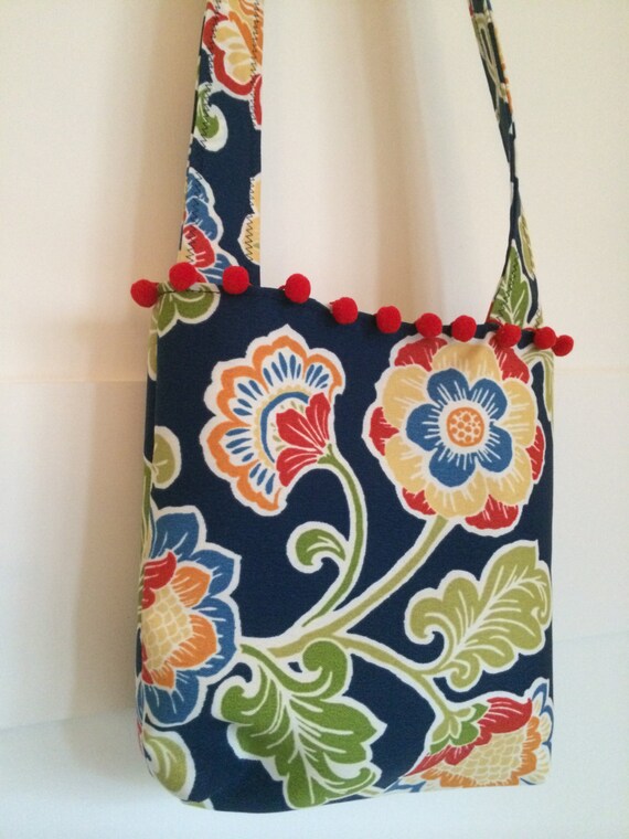 Items similar to Multi flowers on blue with red pom-poms on Etsy