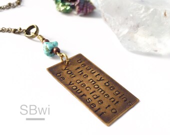 Beauty begins the moment you decide to be yourself. Bronze necklace. Turquoise necklace. Word jewelry. Quote necklace. Font typography.