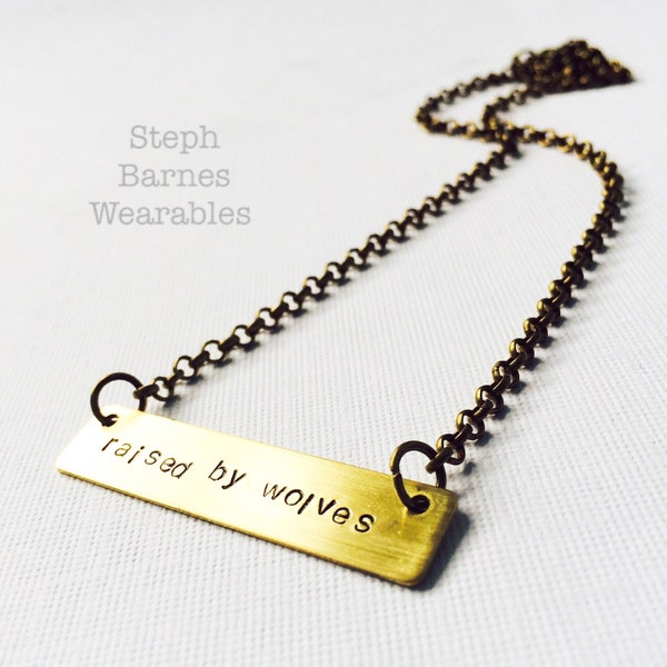 Free domestic shipping on 35USD . Simple 'raised by wolves' necklace in bronze