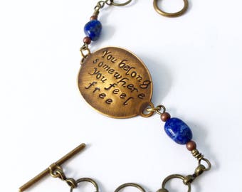 Word bracelet in bronze with lapis detail. Quote jewelry. Bronze jewelry. Simple bracelet. Circle chain. Handmade.