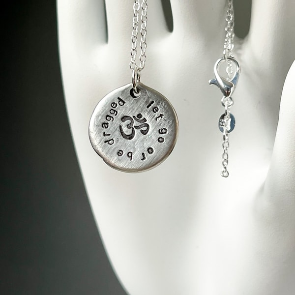 Silver coin necklace. Let go or be dragged. Zen proverb. Silver necklace. Yoga jewelry. Word necklace. Quote jewelry.