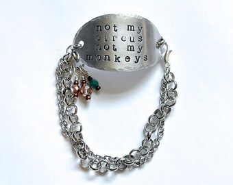 Not my circus not my monkeys bracelet in pewter with copper and turquoise detail. Word jewelry. Quote bracelet.