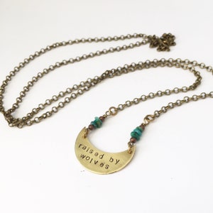 Free domestic shipping on 35USD . Simple &#39;raised by wolves&#39; necklace in bronze with turquoise detail