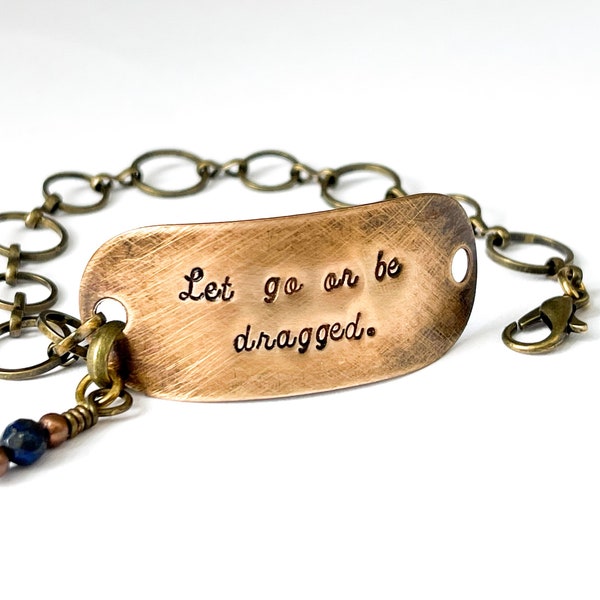 Gold bracelet. Let go or be dragged. Word jewelry. Quote jewelry. Lapis lazuli. Lapis bracelet. Yoga jewelry. Zen proverb.