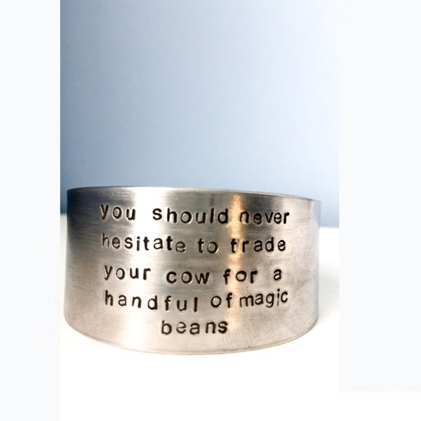 Silver cuff. Cuff bracelet. Tom Robbins. You should never hesitate to trade your cow for a handful of magic beans. Quote jewelry. Word cuff.
