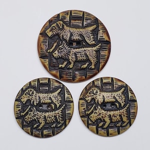 May include: Set of four round buttons with a dog theme. Each button features two dog illustrations, one above the other, set against a textured background. The buttons are primarily brown and tan.