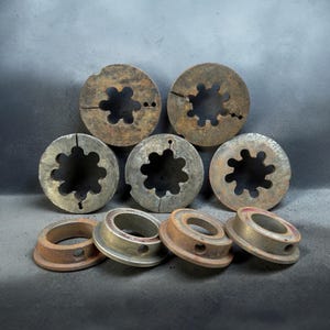 Pipe Threading Dies and Guide Bushings, Possibly Used With Pipe Threader Such as a Reed Manufacturing tool.