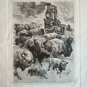 May include: Black and white etching depicting a steam train and a herd of bison. The train is in the background, with a person visible in the cab. The bison are in the foreground, some running. The artwork is signed.
