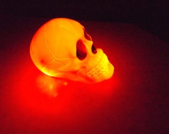 Lighted Plastic glowing Skull battery powered Halloween decoration led lights, blue, red, white,yellow. spooky!