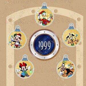 May include: Five Christmas ornaments featuring Disney characters. The ornaments are yellow with gold trim and feature Mickey Mouse, Minnie Mouse, Donald Duck, Goofy, and Pluto. The ornaments are decorated with Christmas lights and other festive details. The ornaments are arranged in a circle around a compass with the year 1999 in the center.