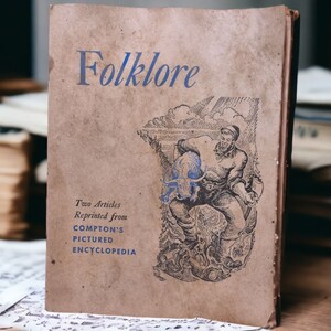 May include: A vintage book titled "Folklore" with a brown cover and blue text. The book features a black and white illustration of a man in a hat holding a large animal. The book cover also includes the text "Two Articles Reprinted from Compton's Pictured Encyclopedia".