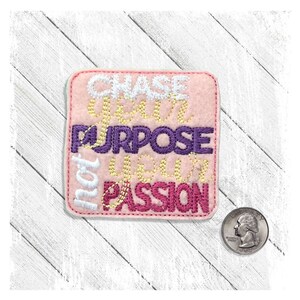 May include: Pink felt patch with the words "Chase Your Purpose, Your Passion" embroidered in white, yellow, purple, and pink thread.