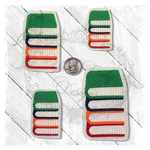 May include: Four embroidered patches of a stack of books. The books are green, white, orange, red, and navy blue. The patches are different sizes.
