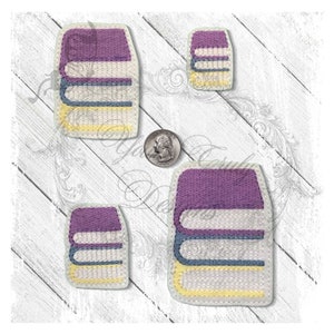 May include: Four embroidered patches of stacked books in different sizes. The books are purple, white, blue, and yellow. The patches are perfect for adding a touch of whimsy to any project.