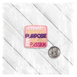 May include: Pink square patch with white, gold, and purple embroidery. The text reads "CHASE YOUR PURPOSE NOT JUST YOUR PASSION".