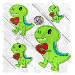 May include: Three green dinosaur appliques holding red hearts. The dinosaurs are different sizes and have blue accents.