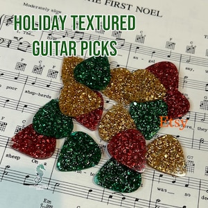 Christmas colored, textured guitar pics with green, red or gold nuggets