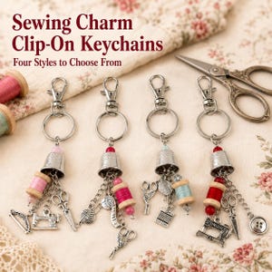 May include: Four silver-toned clip-on keychains featuring sewing-themed charms including miniature thimbles, wooden spools with colored thread, scissors, sewing machines, and buttons. The text Sewing Charm Clip-On Keychains Four Styles to Choose From is visible.