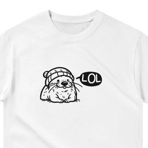 May include: White t-shirt with a black and white cartoon illustration of an otter wearing a beanie hat and saying "LOL" in a speech bubble.