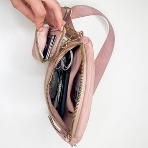Interior of the bag, showing one open compartment, and one interior, zippered pocket.Interior of mini pouch, perfect for cards or hand sanitizer!
