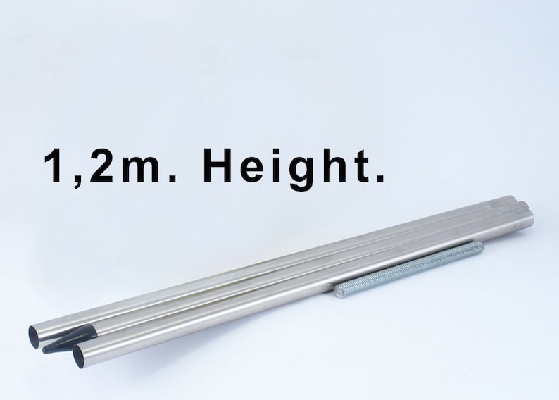 May include: Three silver metal poles with black tips, and a silver metal screw, with the text "1,2m. Height." above them.