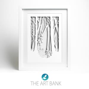 May include: White paper cut art framed in a white frame. The art depicts a forest scene with trees and branches.