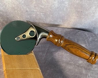 Pizza cutter with handle turned from Monkeypod wood.