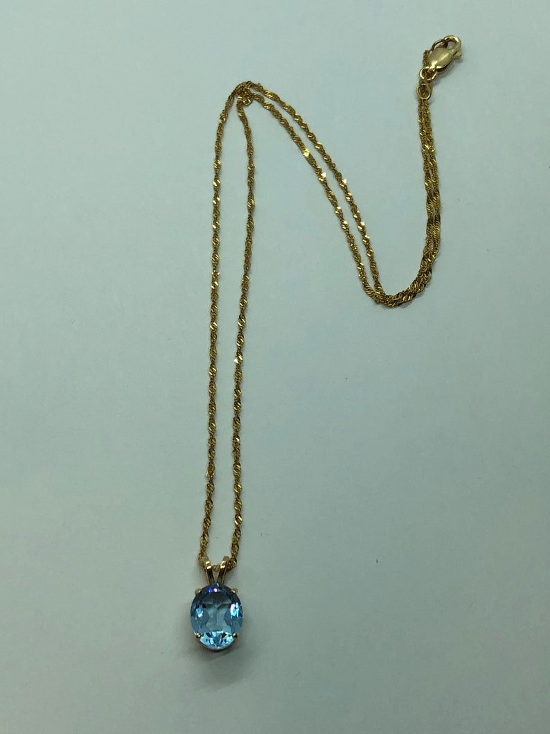 18 Inches 14k Gold Blue Topaz Necklace Pendant on a 14k Gold Rope Style Chain
