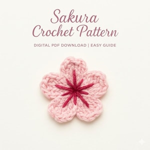 Può includere: Un fiore rosa all'uncinetto con un centro rosa scuro, simile a un fiore di ciliegio. Il testo "Sakura Crochet Pattern" è visualizzato sopra il fiore, con "DIGITAL PDF DOWNLOAD | EASY GUIDE" sotto.