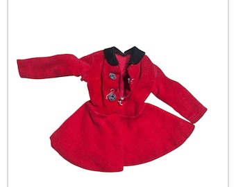 May include: A red doll dress and jacket set. The jacket has a black collar and three decorative buttons. The dress has a flared skirt. The set is made of a soft, textured fabric.
