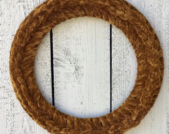 May include: A brown velvet braided wreath, perfect for adding a touch of rustic elegance to your home decor.