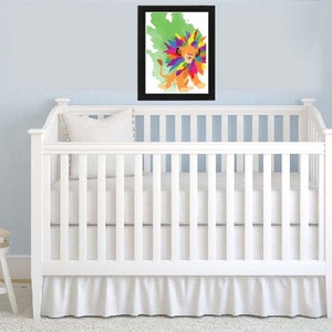 May include: A white crib with a white ruffle skirt and a framed print of a colorful lion with a green background.