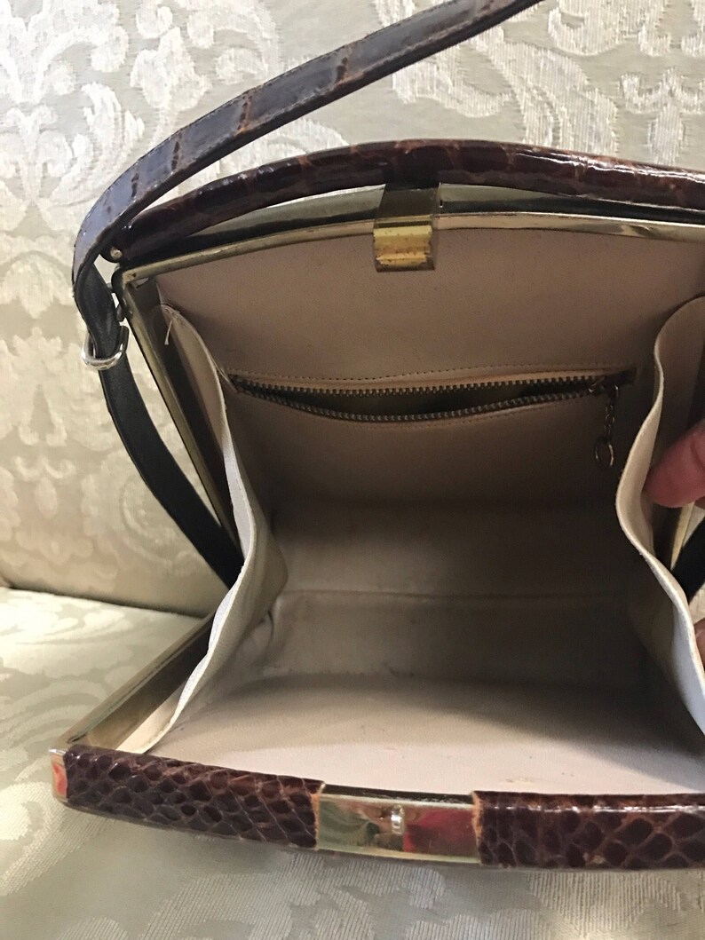 leather kiss lock handbag